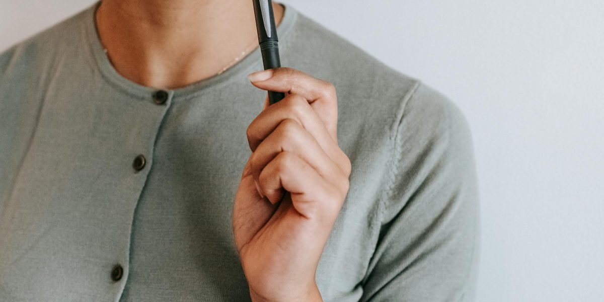 A person carefully considering options, reflecting the importance of model selection and fine-tuning strategies.