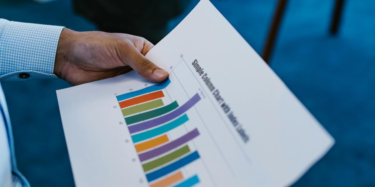 Professionals reviewing data and reports to assess the success and impact of new development strategies.