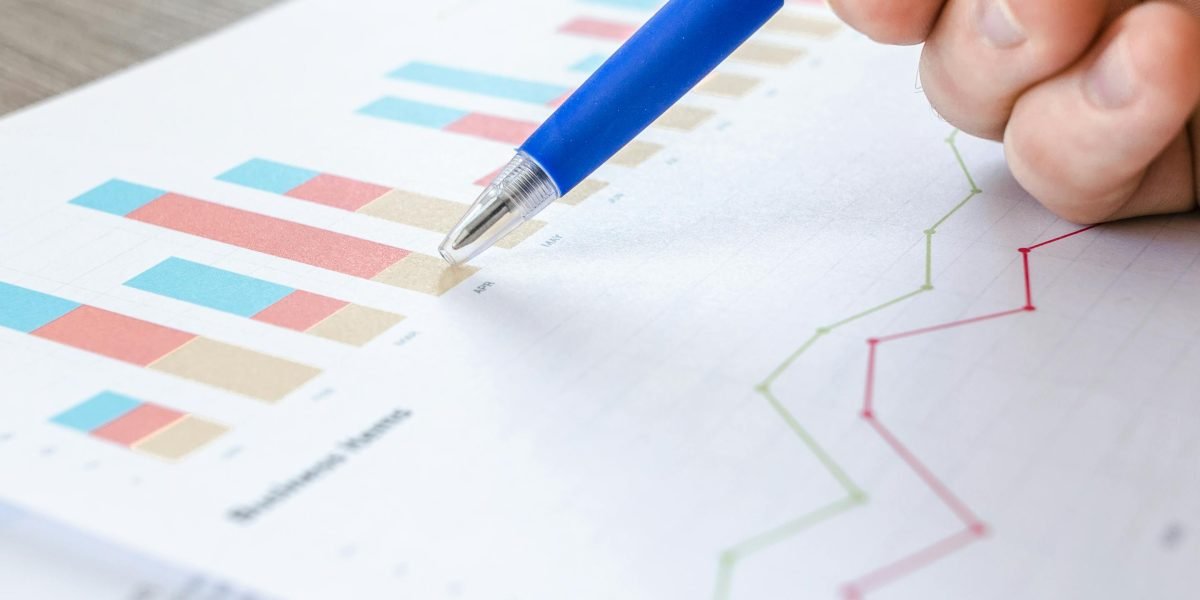 A professional analyzing a performance report, symbolizing the measurement of productivity and code quality metrics.