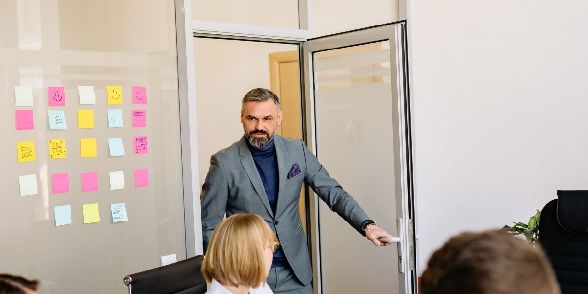 A team engaged in an urgent meeting, conveying the pressure and disruption caused by critical IT downtime.