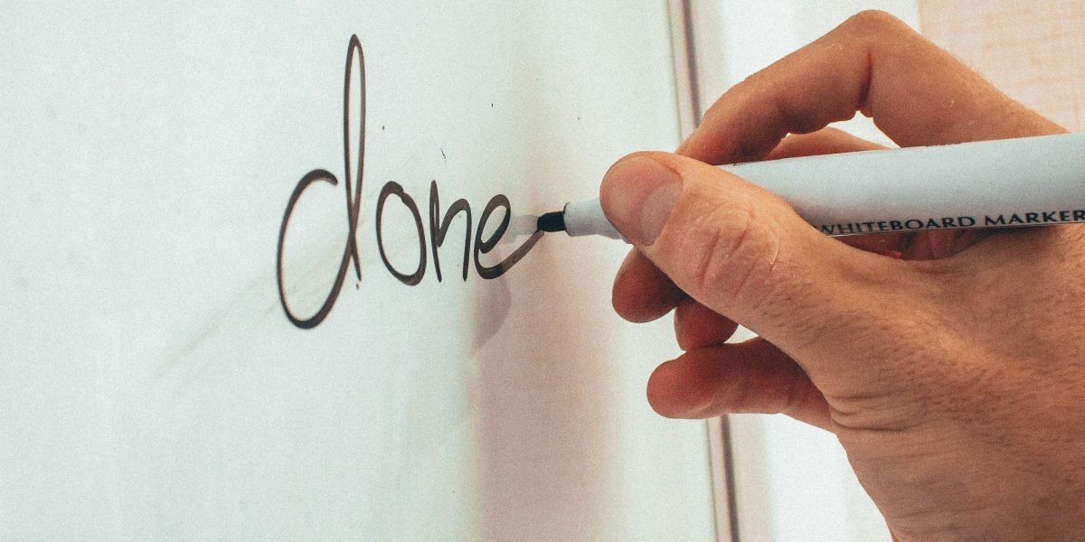 A professional outlines their career aspirations and learning goals on a whiteboard, strategizing their development path.