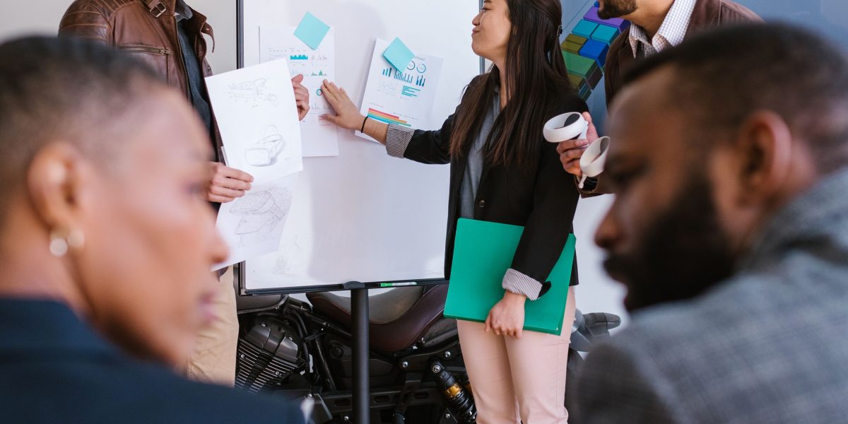 A diverse team collaborating on a project, symbolizing the shift towards open and collaborative AI frameworks.