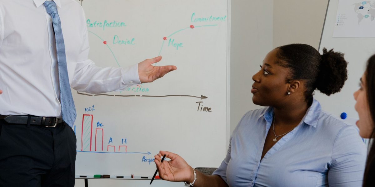 A diverse team critically evaluating options and making strategic decisions for future app development.