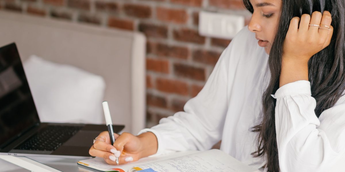 A person comfortably engaged in online learning from home, utilizing the flexibility of MOOCs.