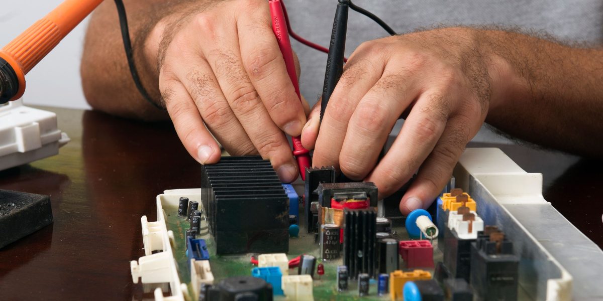 Engineers diligently testing hardware and software, ensuring quality assurance for a new product.