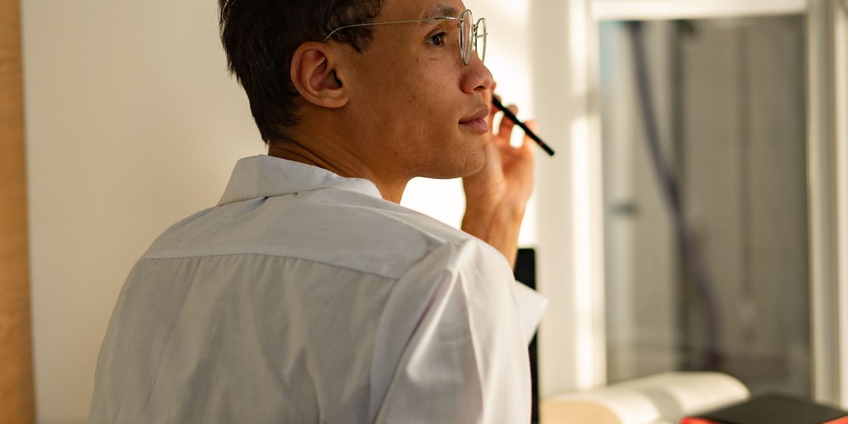 An individual carefully considering options, symbolizing the importance of choosing suitable projects.
