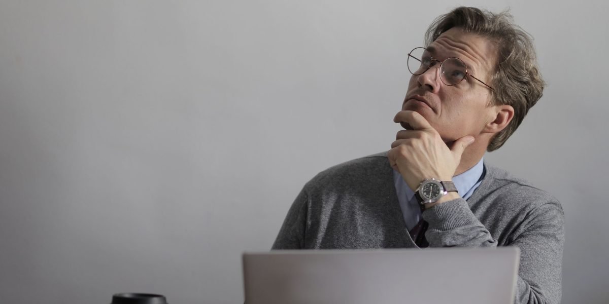 A person deeply focused on a problem, embodying the process of debugging and finding solutions.