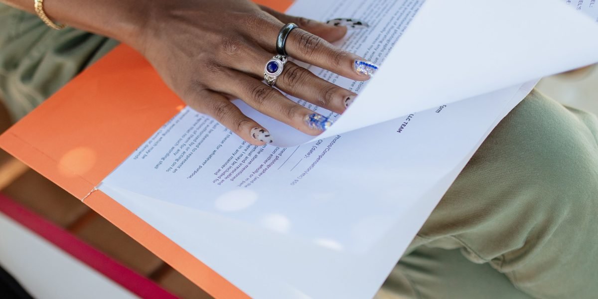 A person intently studying documents, symbolizing the effort to understand new and complex AI terminology.
