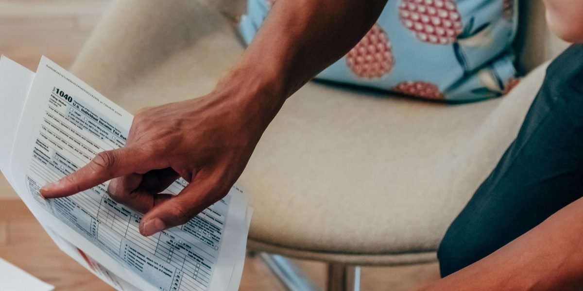 A professional thoughtfully reviewing documents, symbolizing the critical process of assessing risks and ensuring ethical compliance in AI partnerships.
