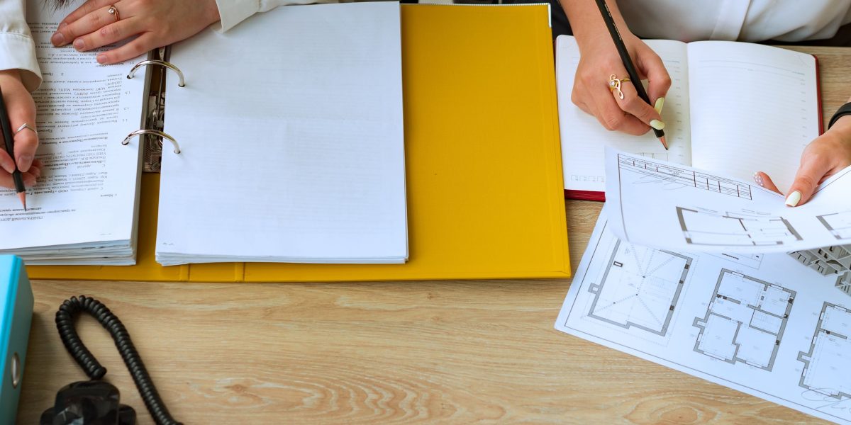 Professionals collaborate on a detailed plan to navigate the complex process of cloud migration successfully.