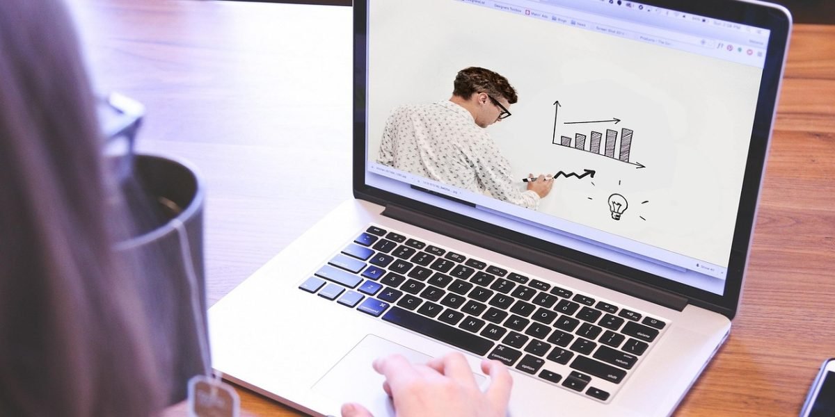 A person focused on an online learning platform, engaged in a course related to software development or engineering.