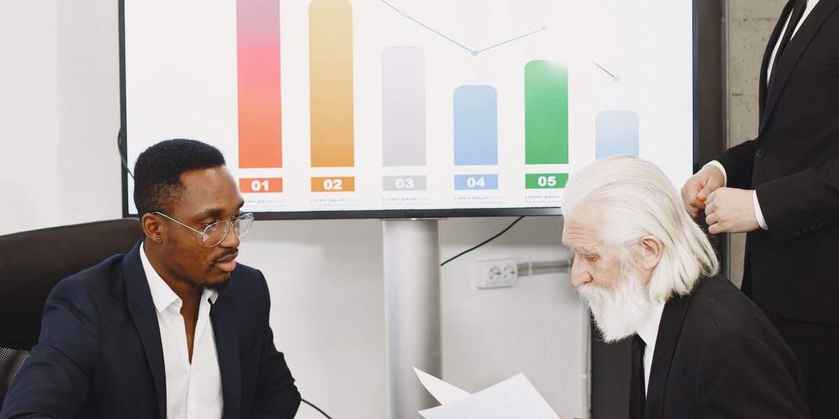 Professionals engaged in a high-level discussion, reflecting leadership and strategic thinking in specialized tech roles.