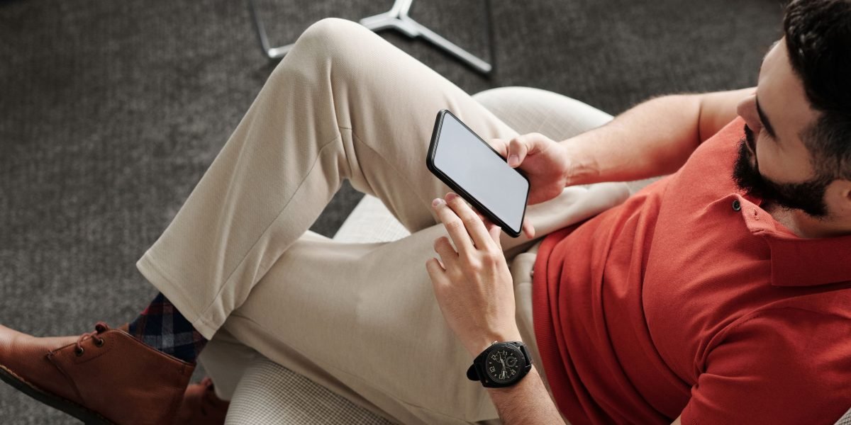 A person reviewing their phone's storage, making decisions about app downloads and data.
