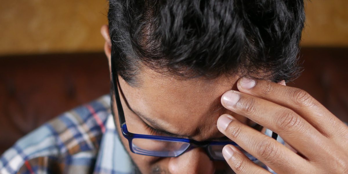 A person contemplating the evolving definition of code in modern software development.