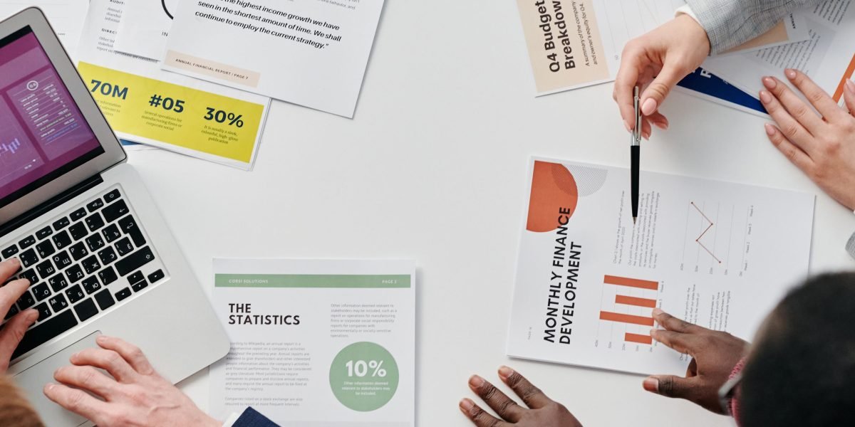 Business leaders reviewing financial reports, illustrating the focus on costs and compensation.