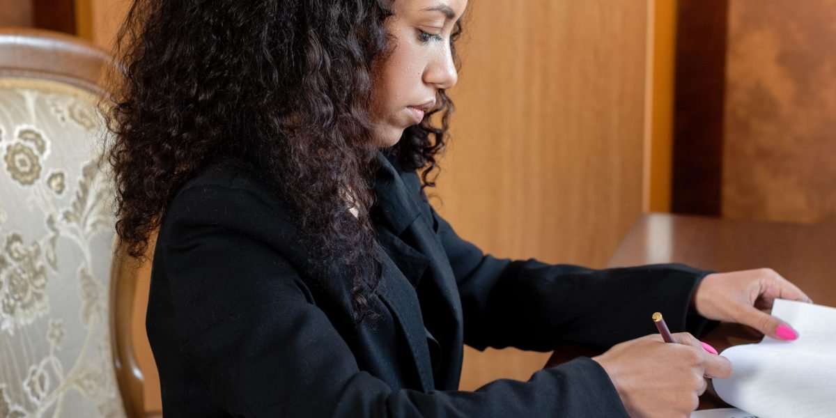 A person critically reviewing work, symbolizing the importance of human oversight even with AI assistance.