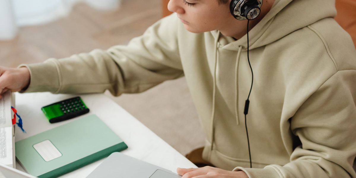 An individual focused on learning new skills, possibly through an online course or tutorial.