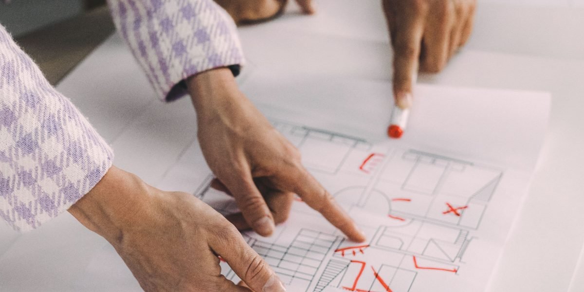 A professional deeply focused on designing a complex system, reflecting the detailed work involved in AI architecture.