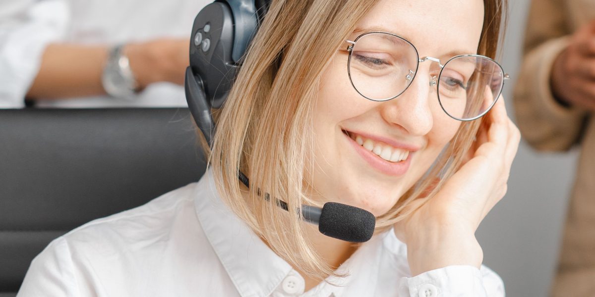A customer service professional attentively assisting a client, symbolizing the practical application of AI in enhancing human interactions.