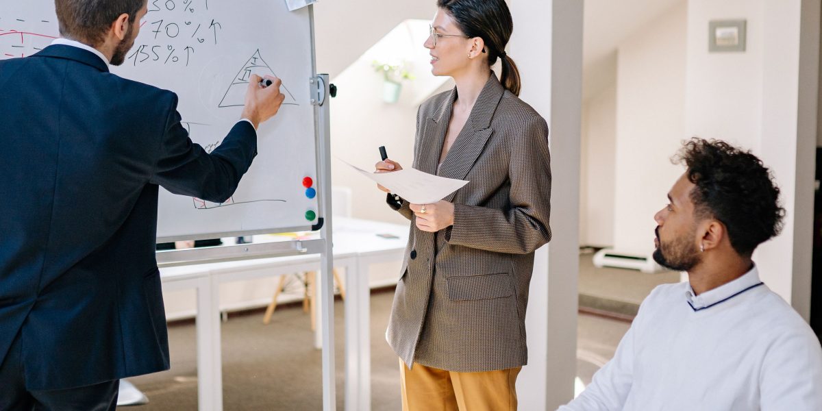 Professionals in a meeting making strategic decisions, representing the critical choice between different AI approaches.