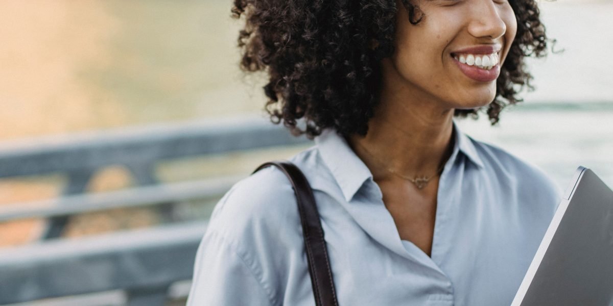 A student looking confident and optimistic about their future career path after gaining real-world experience.