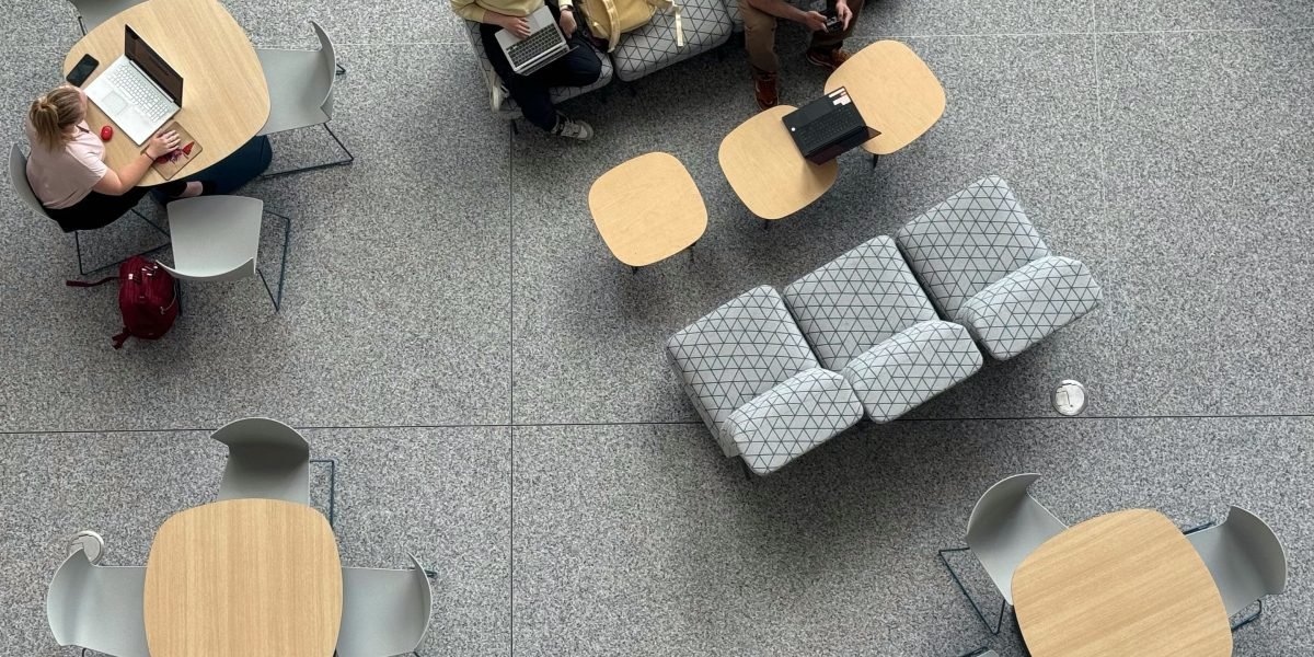 A group of students or young professionals collaborating effectively in an open office environment.
