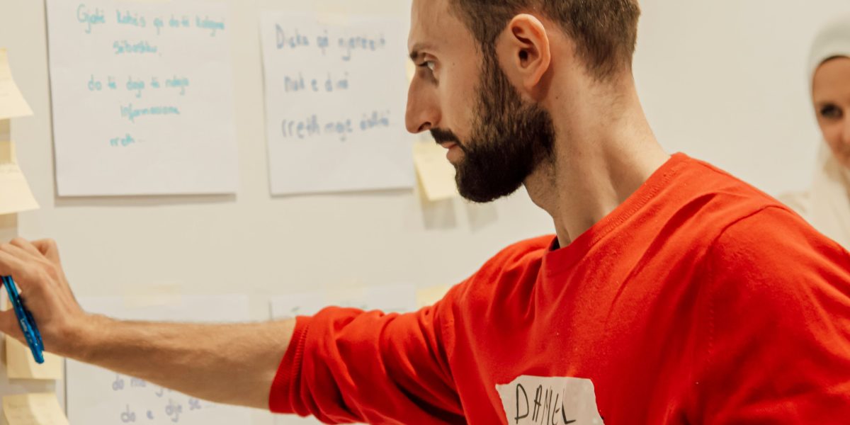 A person actively engaged in a learning process, possibly using microlearning techniques or working on a personal project.