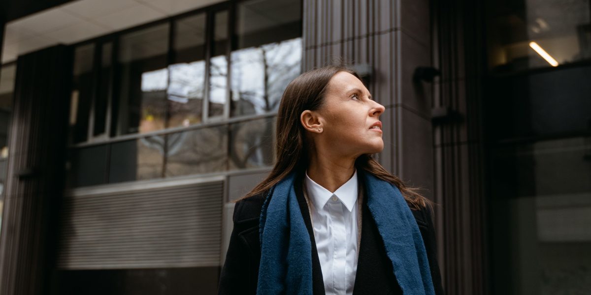A person looks confidently at a whiteboard displaying career paths, representing clarity in a complex job market.