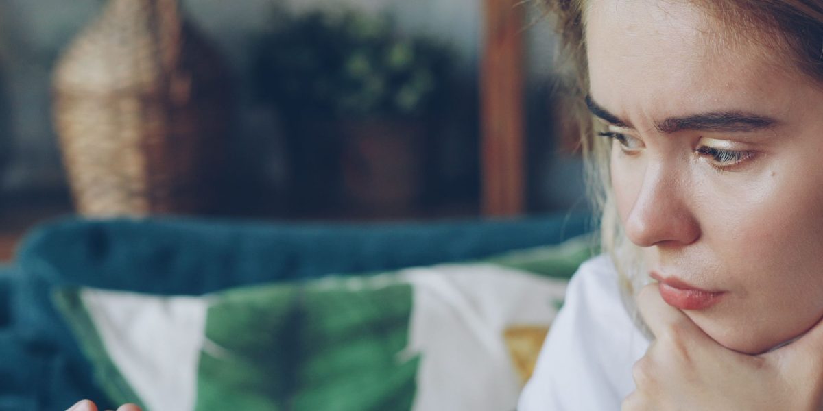 A person deep in thought, considering options for their learning journey and career path.