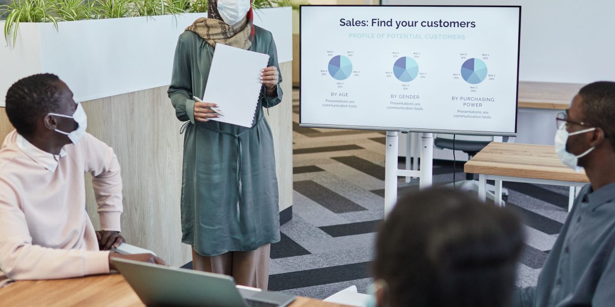 A professional presenting solutions for implementing automated formatting tools to a team.