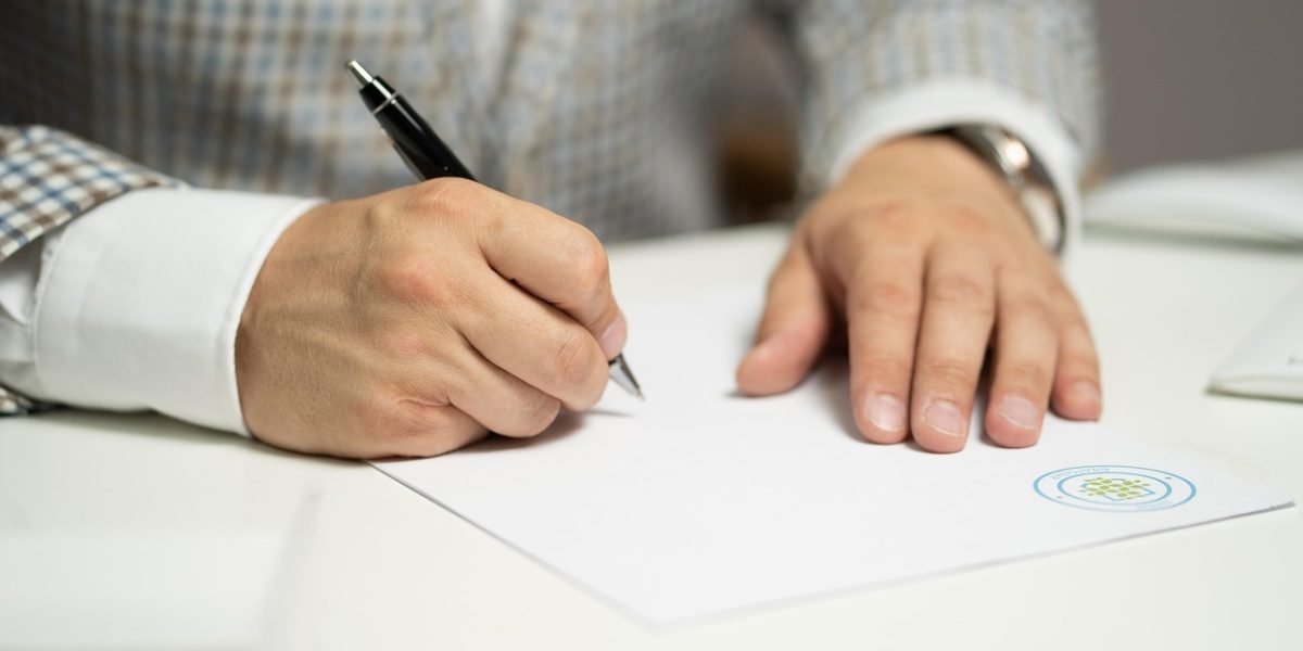 A professional focused on analyzing documents and reports, signifying detailed evaluation.