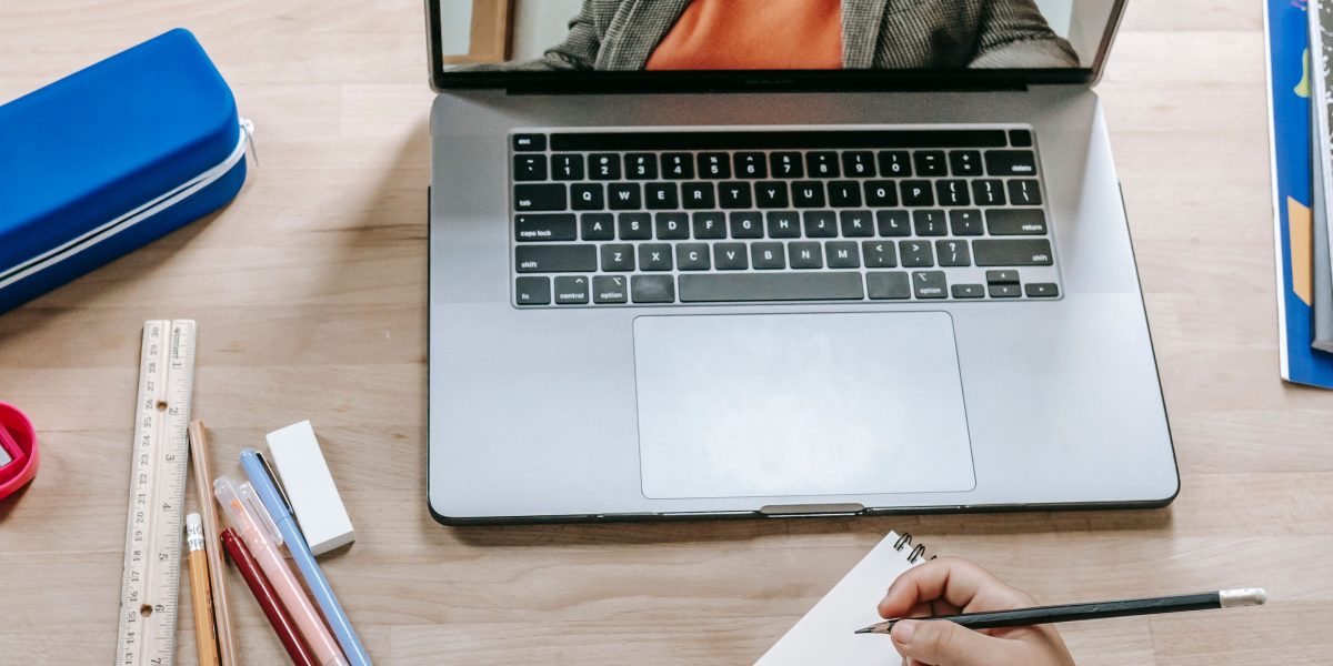 A person engaged in online learning, symbolizing the continuous need for product development engineers to update their skills with future trends.