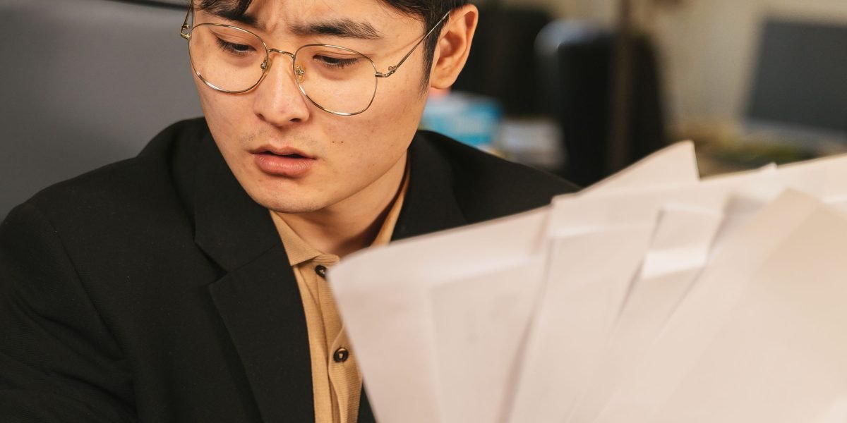 A professional meticulously reviews a job offer, considering all elements beyond just the base salary.